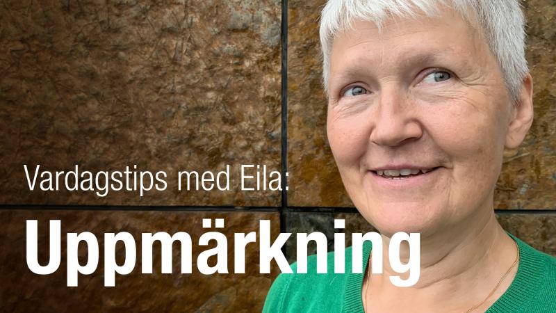 Eila har kortklippt, grått hår och hon ler mot kameran.